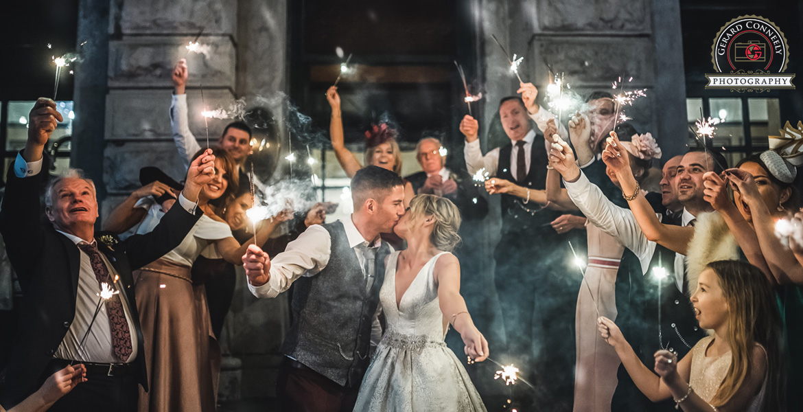 Wedding couple with sparklers at the Hardiman hotel in Galway photo by gerard conneely photography